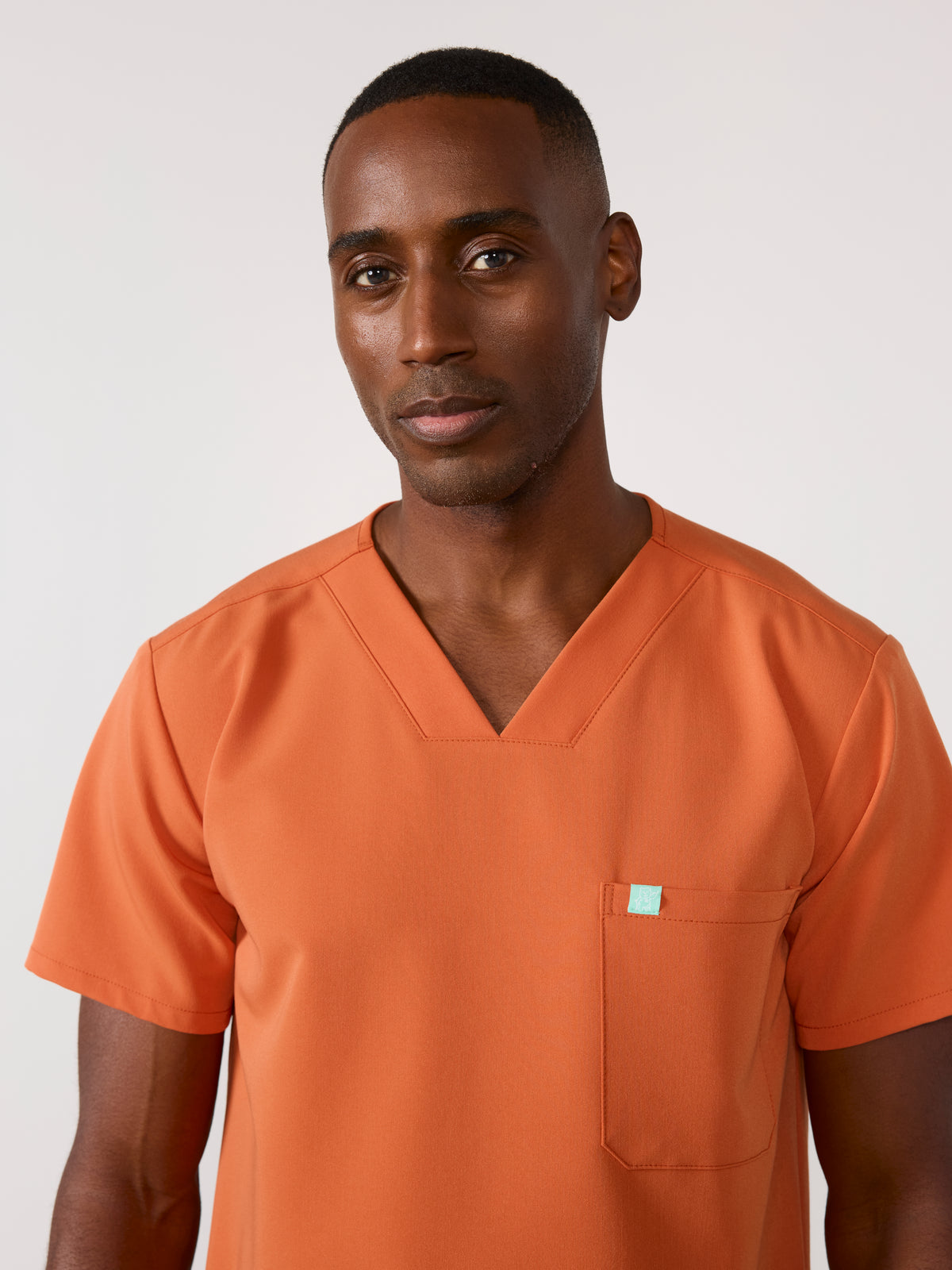 LOGAN RE-GARDE™ - CRÈME BRÛLÉE - One Pocket Men's Scrub Top - SILVADUR™